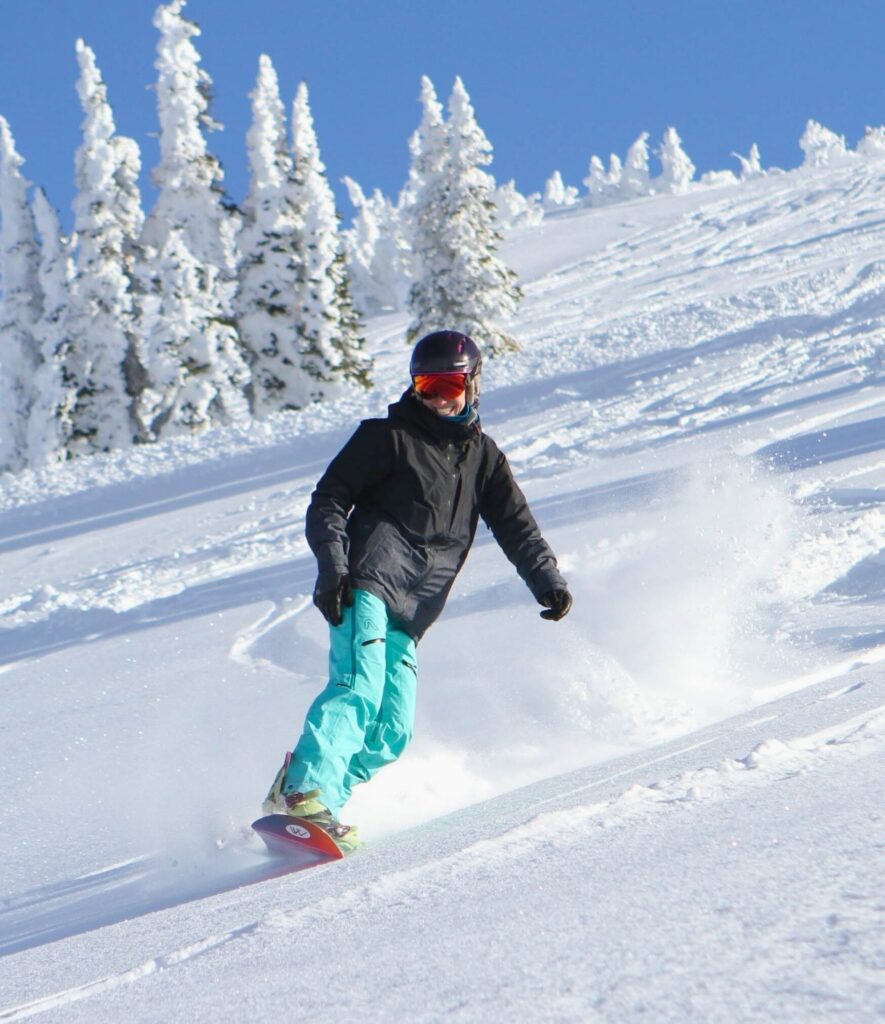 Kimberley of this purely joyful life snowboarding on a bluebird day