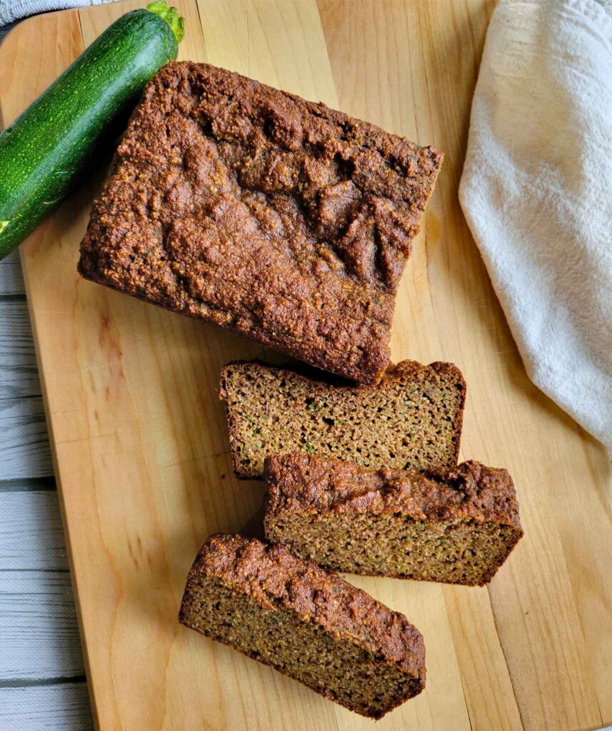 Gluten-free zucchini bread loaf and a few slices of the bread