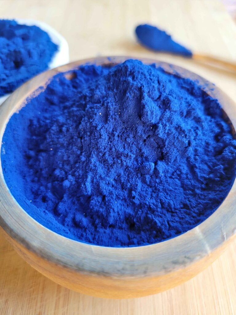 A bowl of healing blue spirulina powder